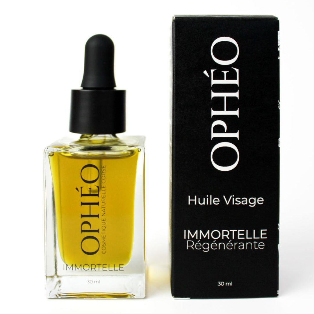 Un flacon d'Huile Visage Immortelle Régénérante de la marque OPHÉO, accompagnée de son emballage carton, noir et blanc au style élégant et épuré.